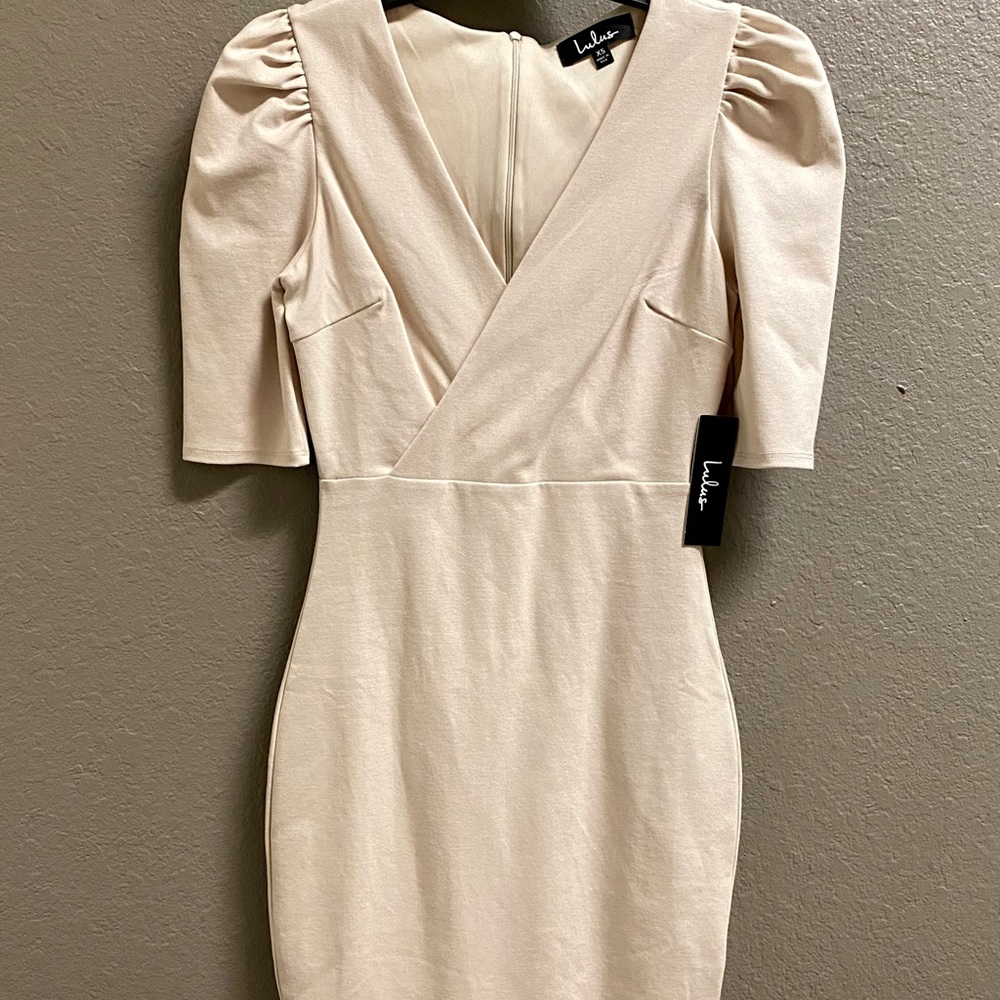 Pencil length dress with small slit down the back